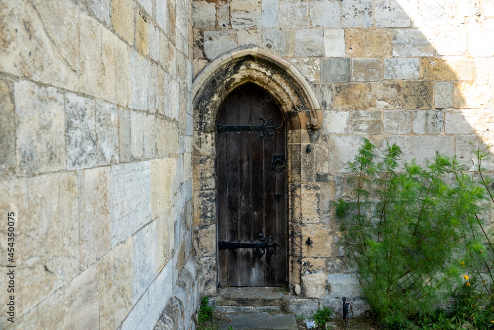Medieval doorway in stone wall