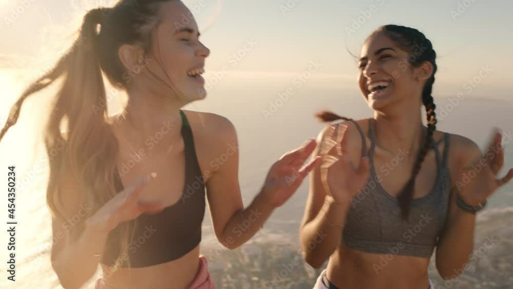 funny girl friends dancing on mountain top celebrating successful hiking adventure with victory dance funny girl friends dancing on mountain top celebrating successful hiking adventure with victory dance