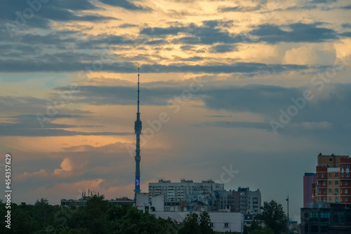Sunset cloudy sky over the city of Moscow and the high spire of the Ostankino TV tower