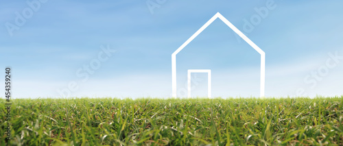 Foto Model house in the meadow with grass in evening