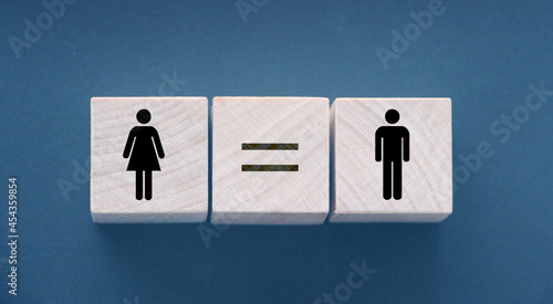 Concepts of gender equality. wooden cubes with female and male symbol and equal sign. Equal pay social quaranty concept