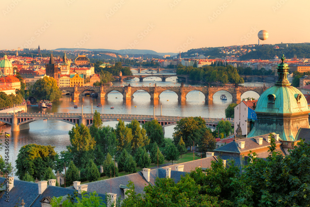 View of the Vltava River and the bridges shined with the sunset sun, Prague, the Czech Republic
