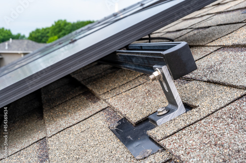 Wallpaper Mural Rail, bracket, and anchor to a solar panel installed on a asphalt shingle roof Torontodigital.ca