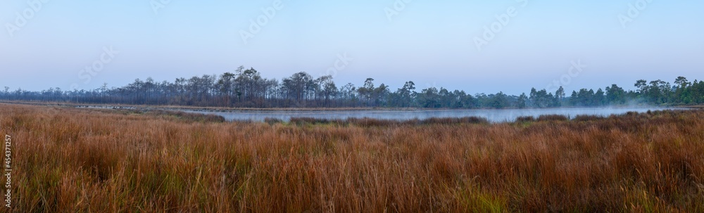 Panoramic view of sunrise over the lake in nation park, Thailand. Panoramic view of sunrise over the lake in nation park, Thailand.