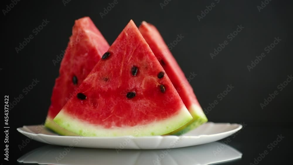 pieces of fresh ripe red watermelon on a wooden table pieces of fresh ripe red watermelon on a wooden table