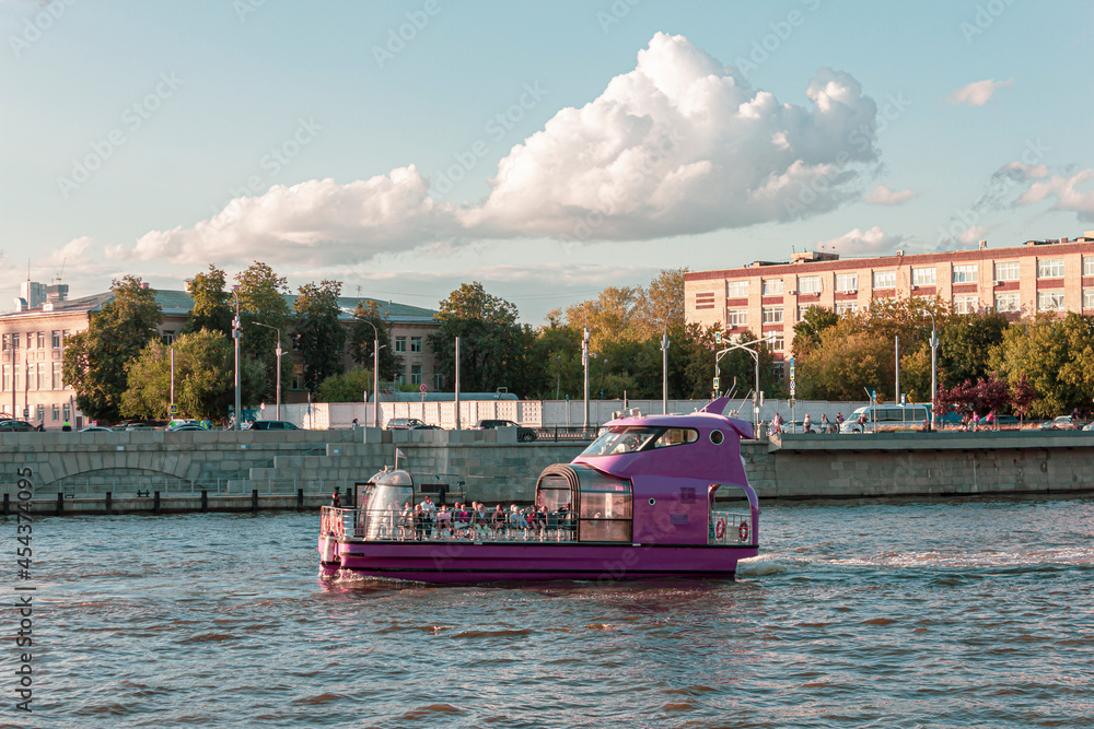 Purple ship sails along the Moscow River