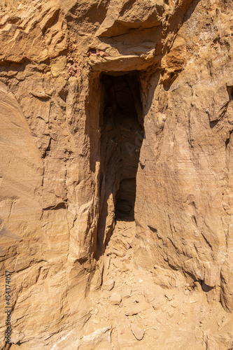 niche in the sheer wall of a stone quarry