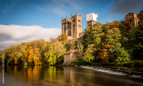 A long exposure of the beautiful Durham Cathedral and the Old Fulling Mill  with the autumn colors reflecting in the River Wear 