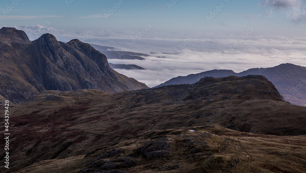The view from above the clouds on Scafell Pike - England's highest peak at 3,209ft, looking across the peaks of the Lake District, Cumbria, England.
