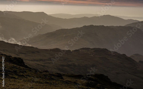 The view from Scafell Pike - England s highest peak at 3 209ft  looking across the peaks of the Lake District  Cumbria  England. 