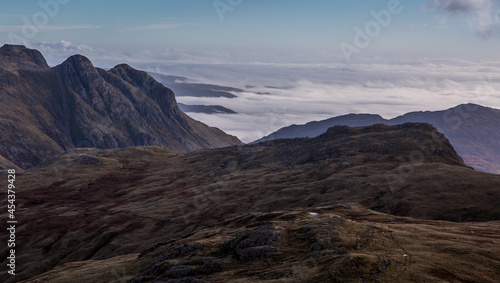 The view from above the clouds on Scafell Pike - England's highest peak at 3,209ft, looking across the peaks of the Lake District, Cumbria, England. 