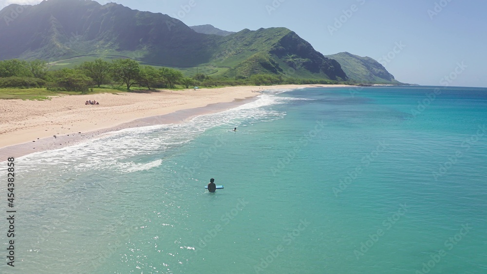 Aerial view from above down Drone shot. Beautiful tropical beach sea with white sand. Top view. Empty and clean beach in summer season on Oahu Hawaii Island.