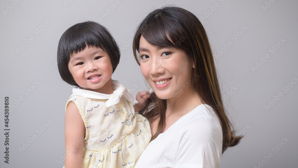 Portrait of happy asian mom and daughter Portrait of happy asian mom and daughter