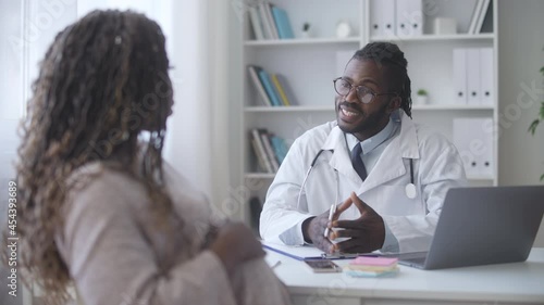 Wallpaper Mural Black pregnant woman having prenatal check-up with male doctor, health Torontodigital.ca
