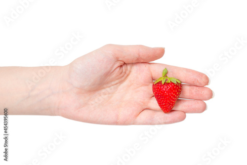 Strawberry kept in hands isolated on white background.