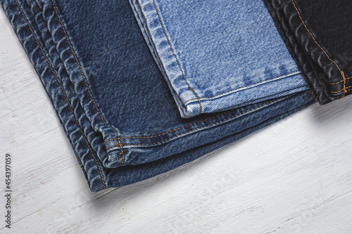 Fotografie Handicraft, clothing repair. Ripped blue jeans sewing accessories
