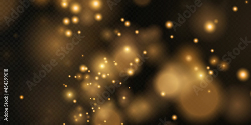 Gold sparkling dust with gold sparkling stars on a transparent background. Glittering texture. Christmas effect for luxury greeting rich card.