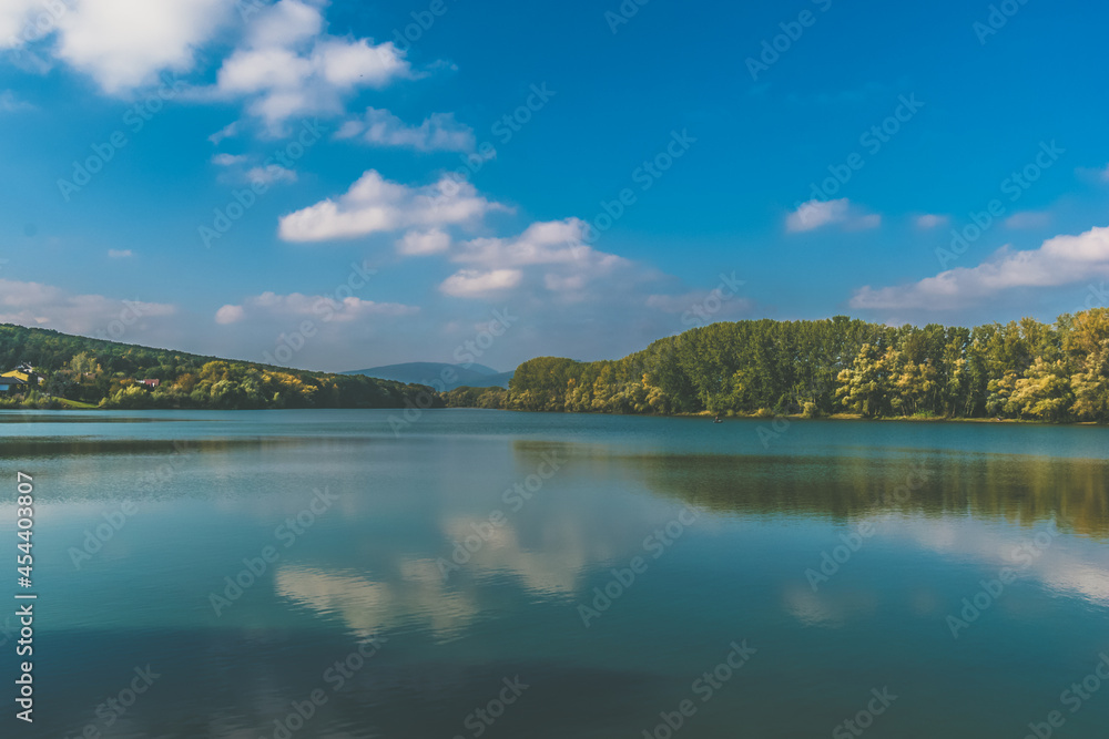 scenic pond with trees around in autumnal colorful atmosphere scenic pond with trees around in autumnal colorful atmosphere