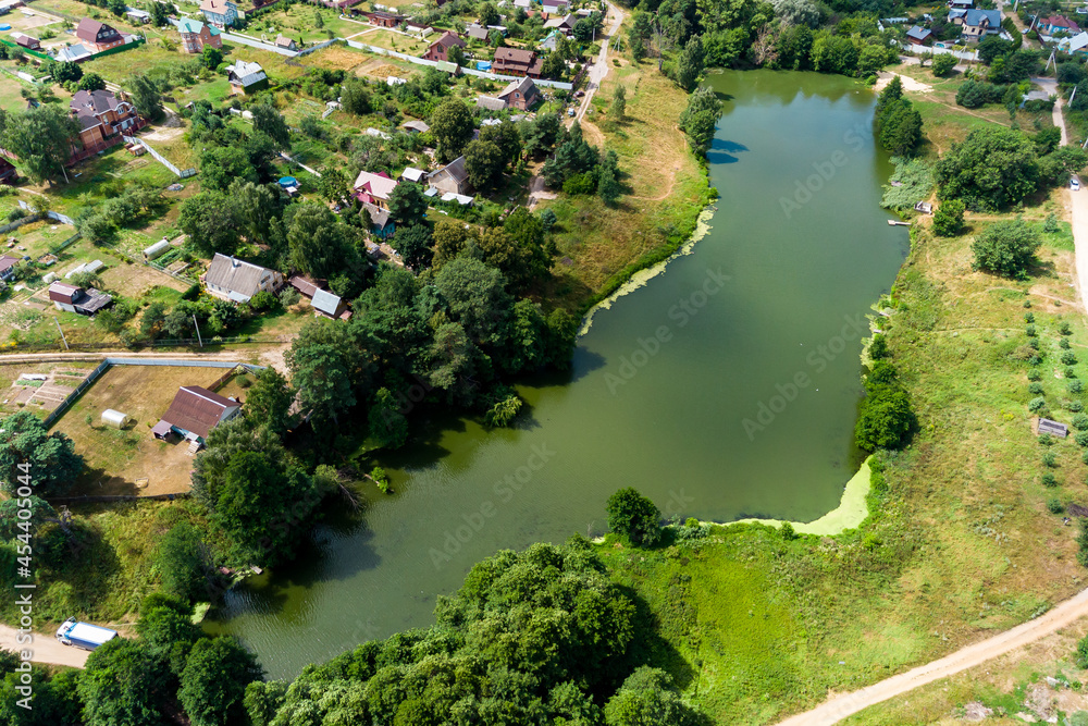 Pond in the village of Lyubitsy, Zhukovsky district, Kaluzhskiy region, Russia. Aerial view of the countryside