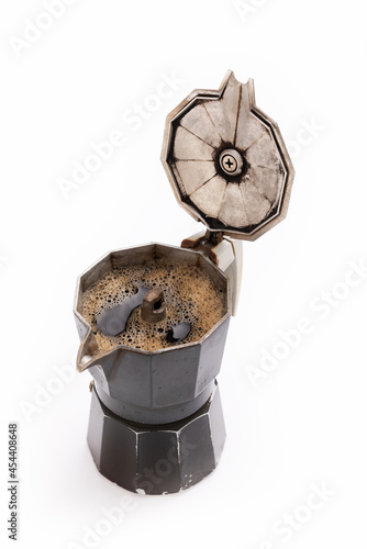 Isolated moka coffee maker closeup with opened lid