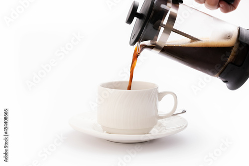 Coffee maker on a white background with a mug