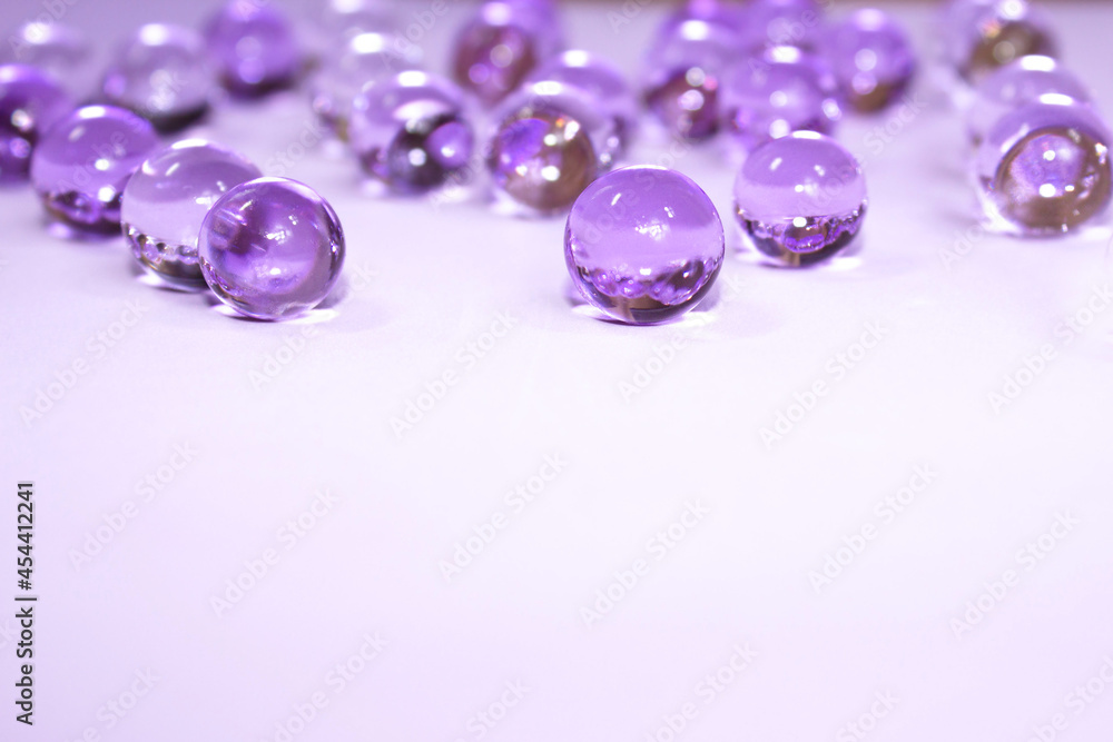 Purple gel on light clean material, macro. Beautiful holiday classic violet background. Christmas or spring wallpaper. Copy space Purple gel on light clean material, macro. Beautiful holiday classic violet background. Christmas or spring wallpaper. Copy space