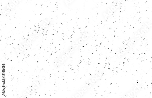 Small uneven spots and particles of debris. Abstract vector texture. Distressed uneven background. Grunge texture overlay with fine grains isolated on white background. Vector illustration. EPS10.