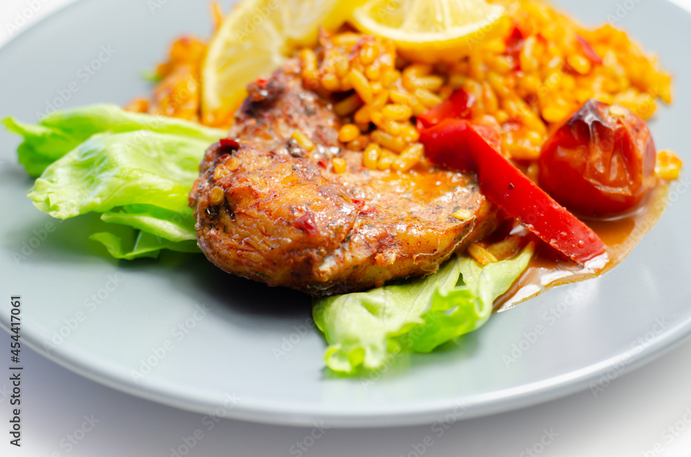 Spicy chicken breast and long grain rice with red peppers, tomatoes and jalapeno chillies Spicy chicken breast and long grain rice with red peppers, tomatoes and jalapeno chillies