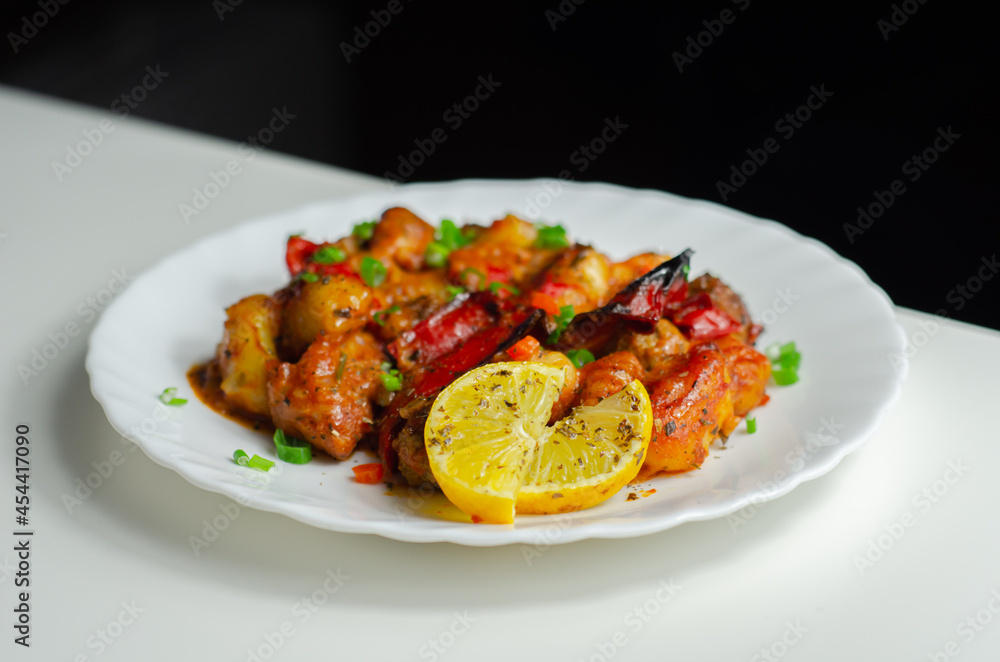 Tuscan style sauce with gnocchi, pork and beef meatballs and grilled red peppers garnished with fresh parsley and chive Tuscan style sauce with gnocchi, pork and beef meatballs and grilled red peppers garnished with fresh parsley and chive
