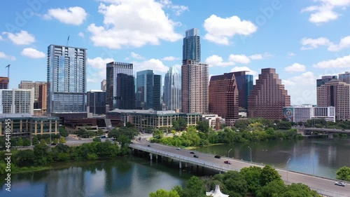 Establishing shot of the Colorado River in downtown Austin, Texas with skyline background. photo