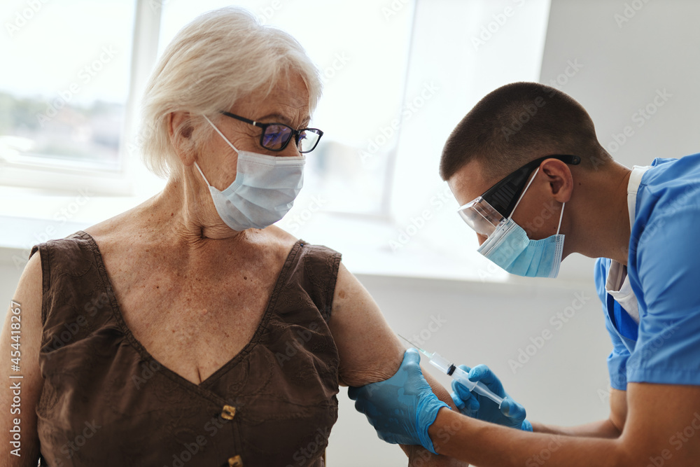 patient wearing medical mask next to doctor vaccination coronavirus covid-19 patient wearing medical mask next to doctor vaccination coronavirus covid-19