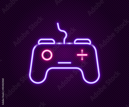 Glowing neon line Gamepad icon isolated on black background. Game controller. Colorful outline concept. Vector