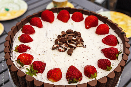 strawberry cake with chocolade palisades around photo