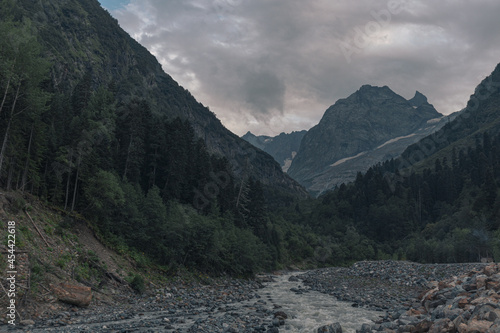 Landscape of high mountains, river and forest in Dombai