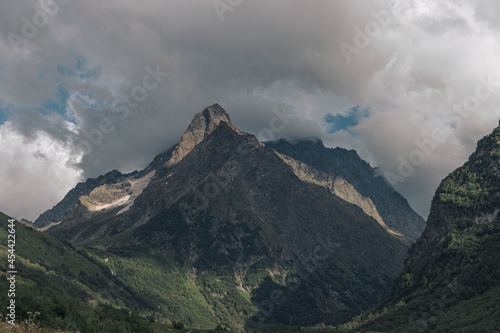 Landscape of high mountains, river and forest in Dombai