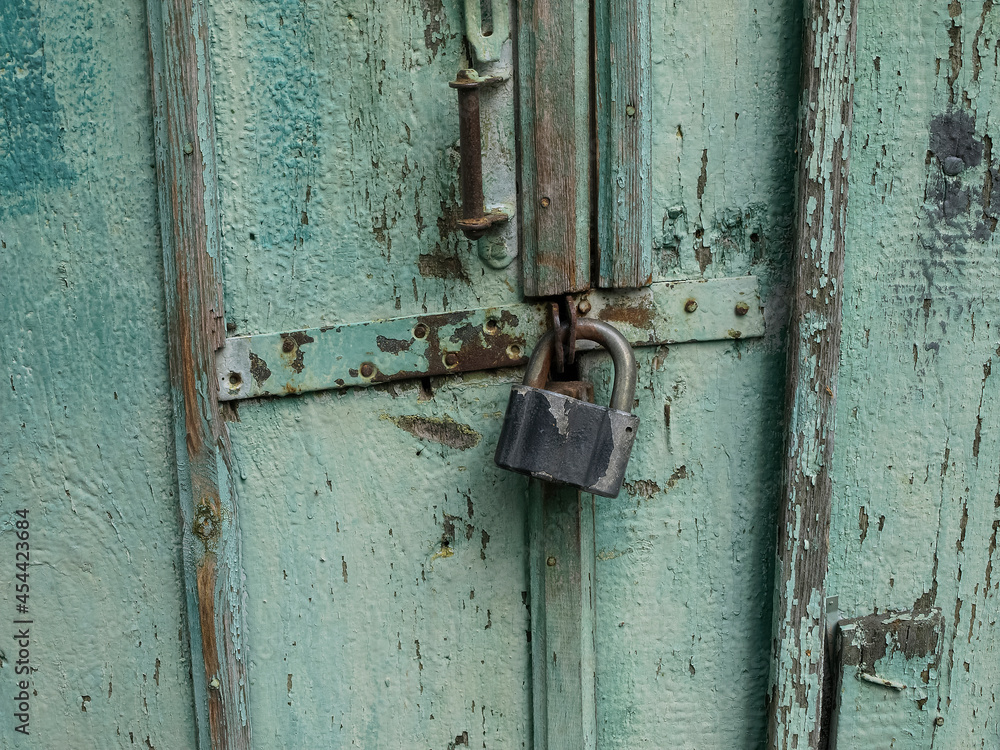 Old door with an external lock Old door with an external lock