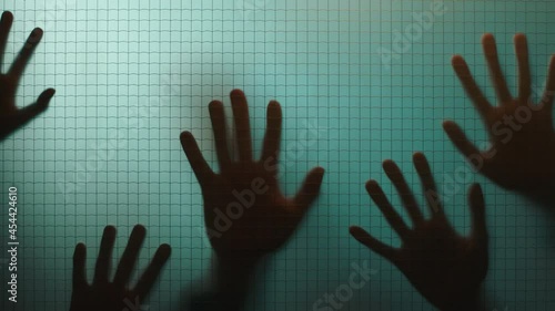 creepy hands on window trapped in mental asylum escape haunting horror concept