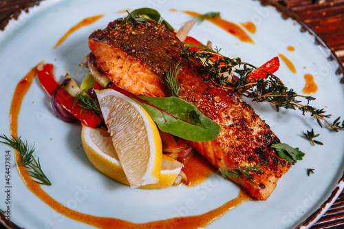 Fried fish in sauce with vegetables