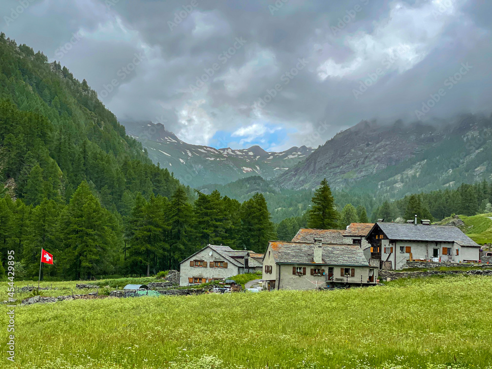 Scenic view of the rocky Swiss mountains surround the quiet village of Simplon. Scenic view of the rocky Swiss mountains surround the quiet village of Simplon.