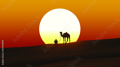 Camel herder watching the sunset