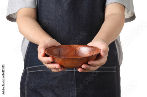 Chef holding wooden cup on white background