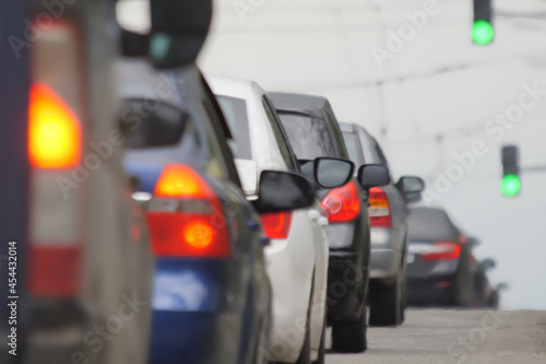 Blurred road car congestion traffic background city defocus. Rush hour traffic jam. Blur background road city congestion in rush hour car traffic day. Crowded cars moving slowly on road busy city blur