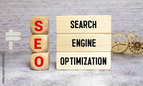 SEO Search Engine Optimization written on dices on blue background
