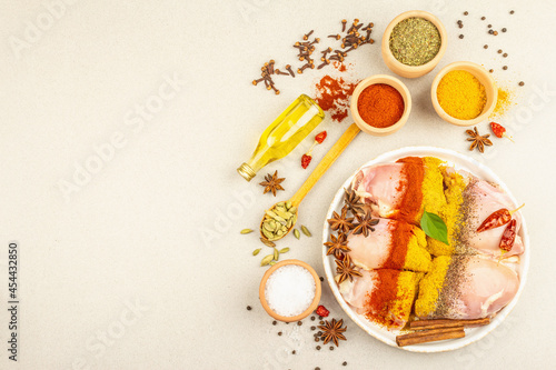 Chicken and curry spices. Set of raw ingredients for cooking traditional food