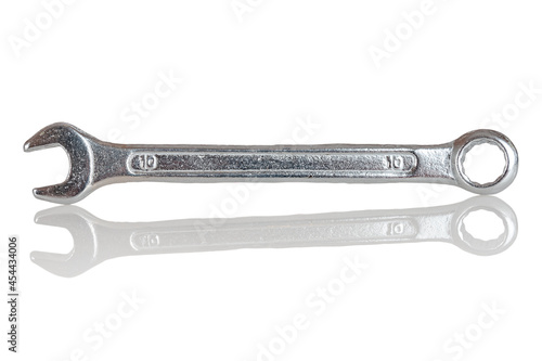 Double-sided metal chrome and vanadium spanner, isolated cap wrench on a white background, close-up photo
