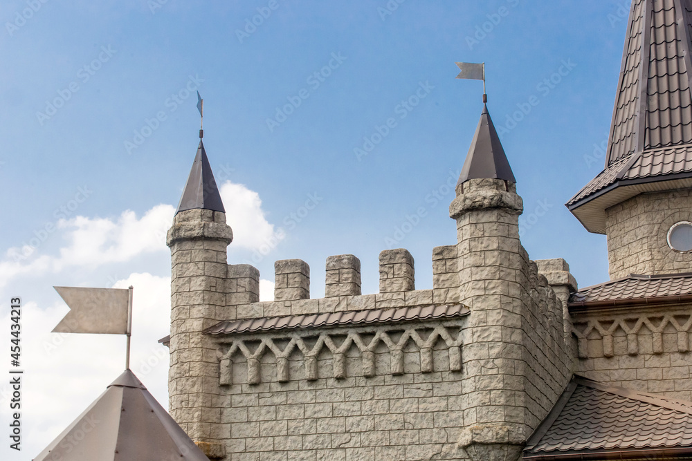 Stone castle medieval old ancient architecture of Europe for tourists on blue sky background