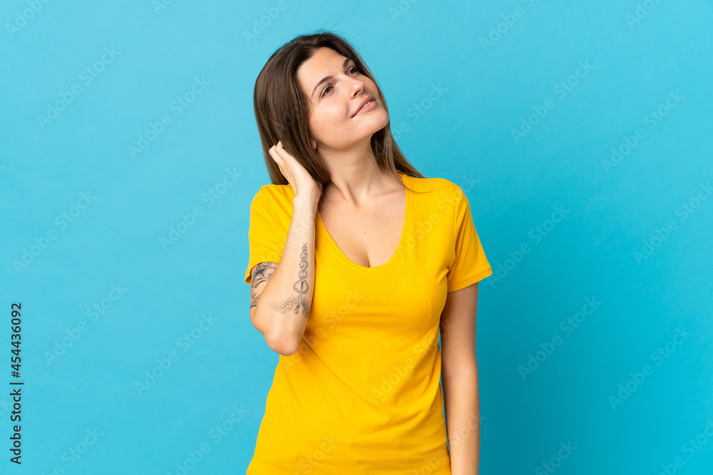 Young slovak woman isolated on blue background thinking an idea Young slovak woman isolated on blue background thinking an idea