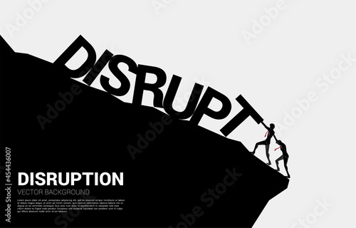 Silhouette of businessman pushing for stop falling disruption. business concept of try to stop the domino effect