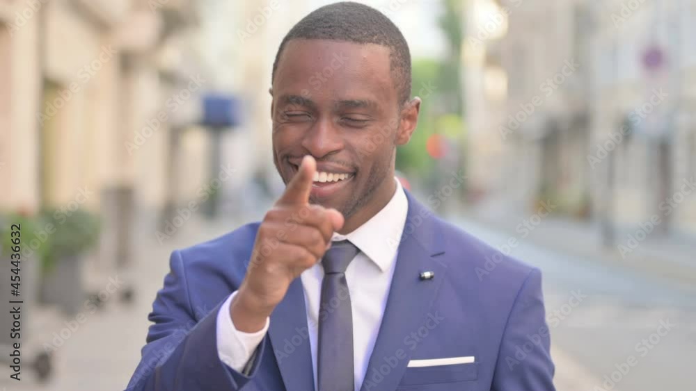 Outdoor African Businessman Pointing at the Camera Outdoor African Businessman Pointing at the Camera
