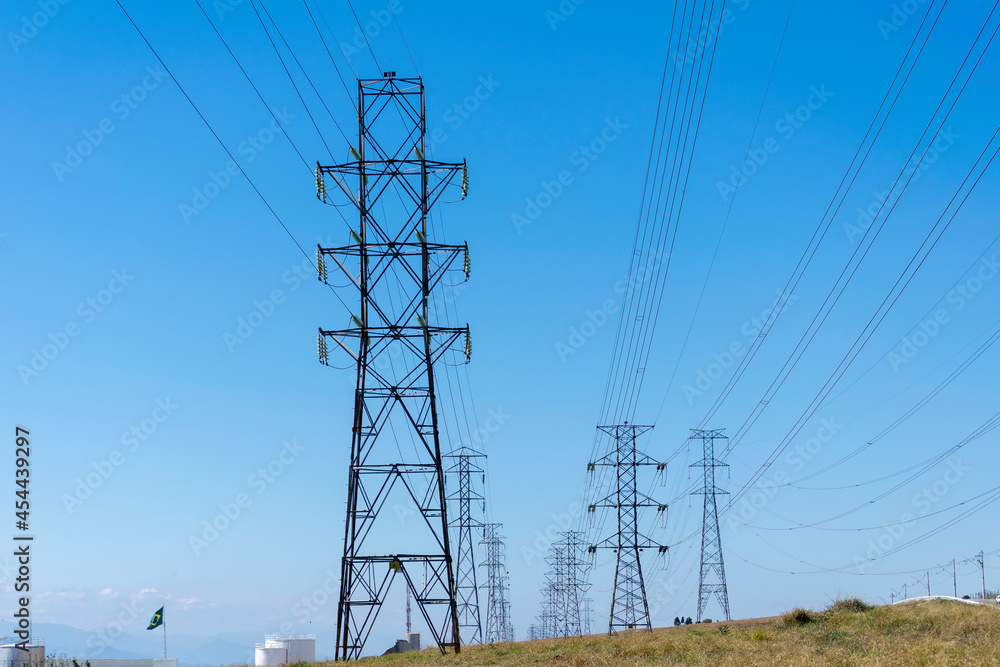 network of power towers with blue sky background
